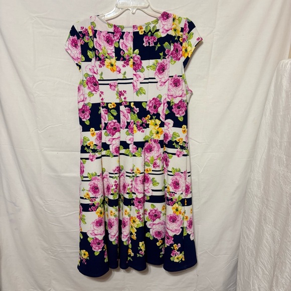 Emma & Michele floral cap-sleeve dress on a navy blue/white striped background. - Picture 6 of 12